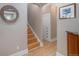 Stairway and hallway area with wood flooring and built in cabinet space for ample storage solutions at 726 S Corona St, Denver, CO 80209
