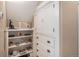 Built-in white storage cabinets and shelving units offer a sleek and organized storage solution in hallway at 726 S Corona St, Denver, CO 80209