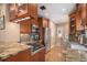 Well-equipped kitchen with granite countertops, stainless steel appliances, and cherry cabinets at 726 S Corona St, Denver, CO 80209