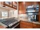 Close-up of the kitchen featuring granite countertops and stainless steel appliances at 726 S Corona St, Denver, CO 80209