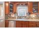 Modern kitchen featuring granite countertops, custom cabinets, and stainless steel appliances at 726 S Corona St, Denver, CO 80209