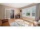 Sunny living room with hardwood floors, large windows, and neutral decor at 726 S Corona St, Denver, CO 80209