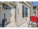 Charming townhome exterior with visible address, offering a welcoming patio area and natural light at 16433 Askins Loop, Parker, CO 80134