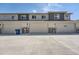 Row of modern garages featuring neutral doors and visible house numbers for easy identification at 16433 Askins Loop, Parker, CO 80134