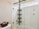Newly renovated bathroom features a custom rain shower head and built in shelving at 12421 Irving Dr, Broomfield, CO 80020