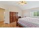 Bedroom with wood floors and a large dresser, showcasing ample storage space at 12421 Irving Dr, Broomfield, CO 80020