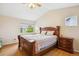 Bedroom with wood floors and a cozy quilt atop a queen-sized bed at 12421 Irving Dr, Broomfield, CO 80020