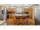 Spacious kitchen with stainless steel appliances, granite countertops, and large center island at 12421 Irving Dr, Broomfield, CO 80020