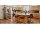 Spacious kitchen with stainless steel appliances, granite countertops, and large center island at 12421 Irving Dr, Broomfield, CO 80020
