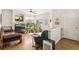 Bright living room with hardwood floors, many plants, and a decorative fireplace at 12421 Irving Dr, Broomfield, CO 80020