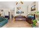 Cozy living room with hardwood floors, decorative fireplace and staircase in view at 12421 Irving Dr, Broomfield, CO 80020