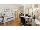 Home office and music room with a white piano and a comfortable desk setup at 12421 Irving Dr, Broomfield, CO 80020