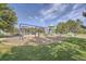 Colorful playground with swings, slides, and play structures for enjoyment and recreation at 12421 Irving Dr, Broomfield, CO 80020