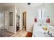 Double vanity bathroom with a separate shower and toilet at 180 Cook St # 105, Denver, CO 80206