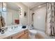 Clean bathroom with shower/tub combo, and updated vanity at 180 Cook St # 105, Denver, CO 80206