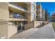 Welcoming condo building entrance with a nicely landscaped walkway at 180 Cook St # 105, Denver, CO 80206