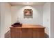 Bright entryway with wooden console table and wall art at 180 Cook St # 105, Denver, CO 80206