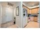 Bright and spacious entryway with kitchen and hardwood floors at 180 Cook St # 105, Denver, CO 80206