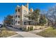 Modern condo building with attractive landscaping and convenient street parking at 180 Cook St # 105, Denver, CO 80206