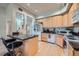 Open concept kitchen with granite island and breakfast bar at 180 Cook St # 105, Denver, CO 80206