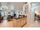 Open kitchen with island and views into the living area at 180 Cook St # 105, Denver, CO 80206