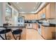 Kitchen boasts granite countertops and light wood cabinetry at 180 Cook St # 105, Denver, CO 80206