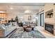 Open living space with hardwood floors, a fireplace, and a cozy atmosphere at 180 Cook St # 105, Denver, CO 80206