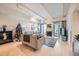 Light-filled living room features hardwood floors, fireplace, and access to a patio at 180 Cook St # 105, Denver, CO 80206