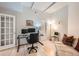 Bright home office with hardwood floors and built-in workspace at 180 Cook St # 105, Denver, CO 80206