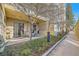 Outdoor patio with seating area and private walkway at 180 Cook St # 105, Denver, CO 80206