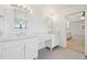 Luxurious bathroom featuring dual sinks, marble countertops, and modern fixtures at 5528 S Jasper Way, Centennial, CO 80015