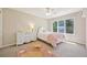 Comfortable bedroom featuring natural light and a full-size bed at 5528 S Jasper Way, Centennial, CO 80015