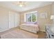 Cozy bedroom with window seat, built-in storage, and a ceiling fan at 5528 S Jasper Way, Centennial, CO 80015