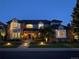 Two-story home with brick and siding exterior, landscaped lawn, and inviting entrance at 5528 S Jasper Way, Centennial, CO 80015