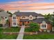 Beautiful two-story home with manicured lawn, mature trees, and classic design at 5528 S Jasper Way, Centennial, CO 80015