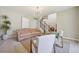 Bright living room featuring neutral paint, hardwood floors, staircase and natural light at 5528 S Jasper Way, Centennial, CO 80015