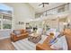 Open-concept living room with hardwood floors and a view of the second-story landing at 5528 S Jasper Way, Centennial, CO 80015