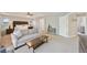 Inviting main bedroom with sitting area, neutral tones, and ample natural light at 5528 S Jasper Way, Centennial, CO 80015