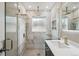 Stylish bathroom with glass enclosed shower, marble tile, and elegant fixtures at 2664 Forest St, Denver, CO 80207