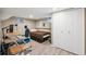 Bedroom with a bed, desk, laminate floors, and white closet at 2664 Forest St, Denver, CO 80207
