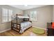 Bedroom with wooden bunk beds, hardwood floors and bright windows at 2664 Forest St, Denver, CO 80207