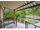 Inviting covered front porch with seating and views of the landscaped front yard at 2664 Forest St, Denver, CO 80207