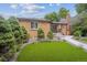 Well-maintained brick house with a green lawn and trimmed landscaping, offering great curb appeal at 2664 Forest St, Denver, CO 80207