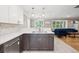 Open kitchen provides stainless steel sink, and a seamless flow to the adjacent living room at 2664 Forest St, Denver, CO 80207
