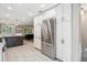 Updated kitchen has stainless appliances, plenty of storage, and a seamless flow to the living area at 2664 Forest St, Denver, CO 80207