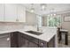 Modern kitchen showcasing stainless steel sink, and a seamless flow to the adjacent dining area at 2664 Forest St, Denver, CO 80207