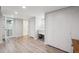Large living area with a laundry area and laminate floors at 2664 Forest St, Denver, CO 80207