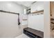 Functional mudroom with built-in bench, storage cabinets, and coat hooks for organized entryway at 2664 Forest St, Denver, CO 80207