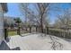 Back deck featuring black railings, a wooden surface, and a view of the fenced backyard at 20344 Heather Ln, Parker, CO 80138