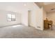 Spacious basement area with gray carpeting and a window that provides natural light at 20344 Heather Ln, Parker, CO 80138
